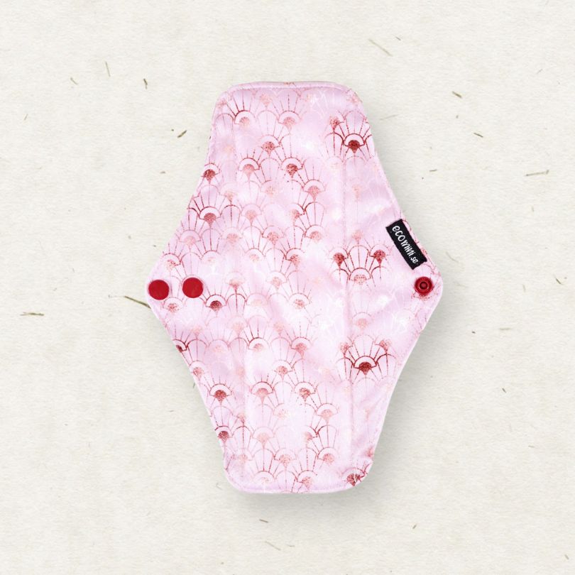 Eco Mini Reusable menstrual pad with pink floral pattern on a light background