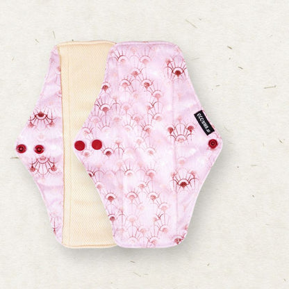 Eco Mini Reusable menstrual pad with pink floral pattern on a light background