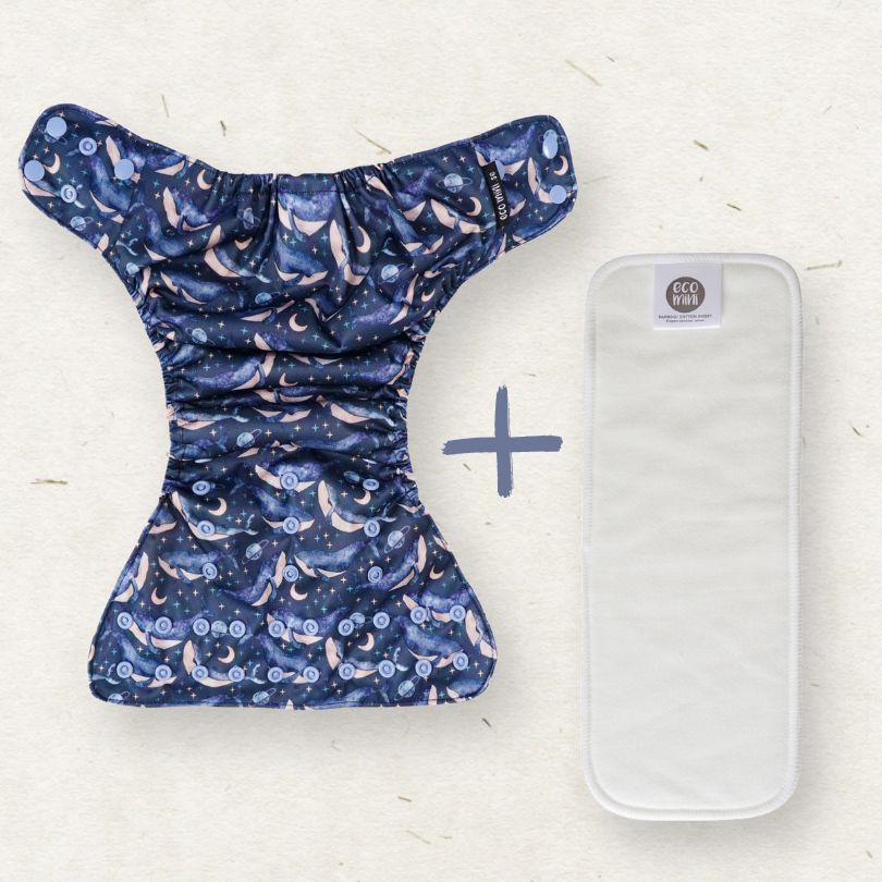 Eco Mini cloth diaper with a whale-themed pattern featuring animals and plants on a white background