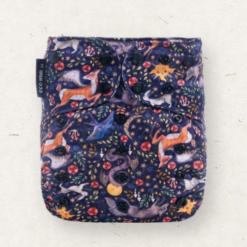 Eco mini cloth diaper with nature-themed design on a white background