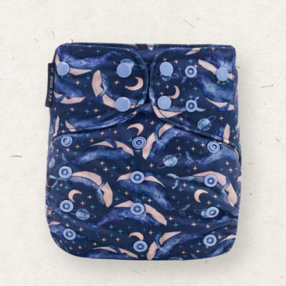 Eco Mini reusable cloth diaper with whale-themed pattern on a white background