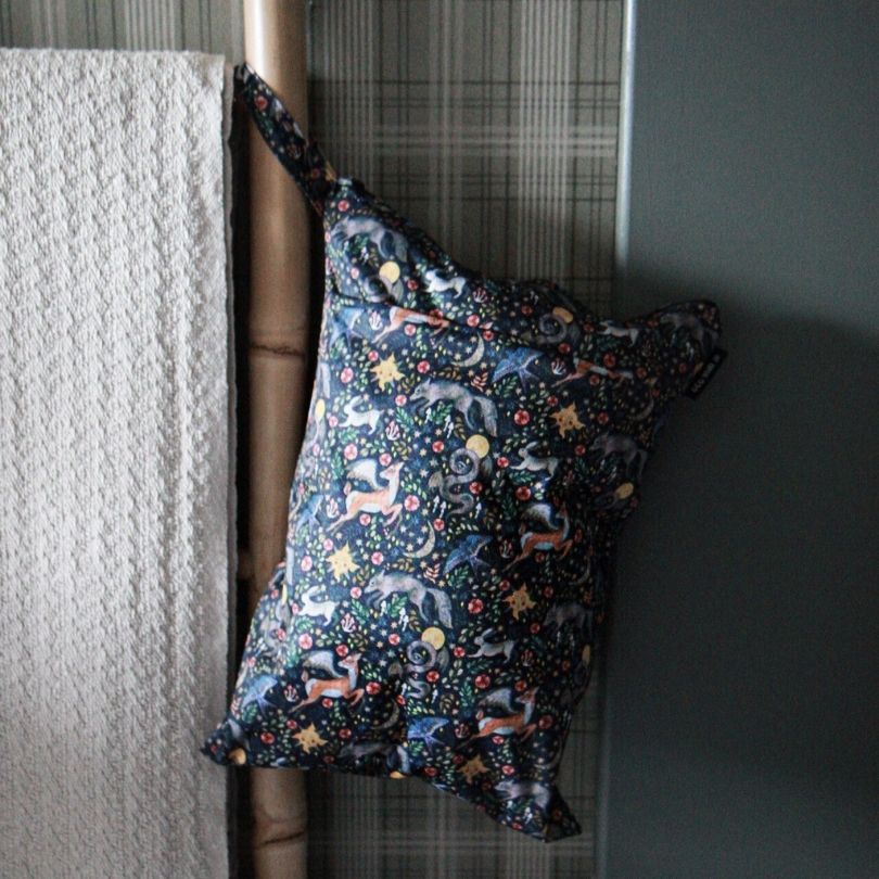 Eco mIni wet bag hanging on a towel rail