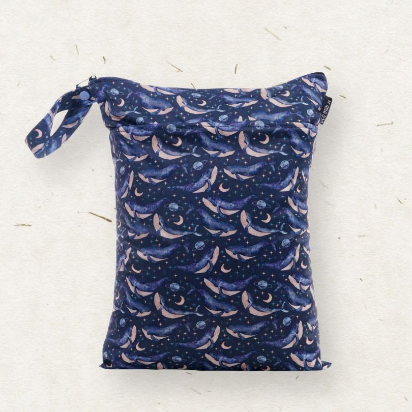Eco Mini wet bag with whales print on light background