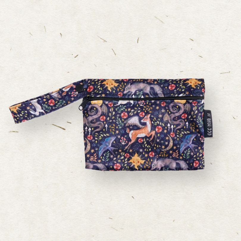 Patterned Eco mIni wet bag with zipper on a light gray background