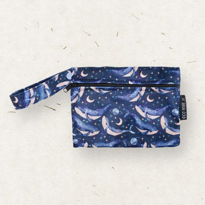 Eco Mini wet bag with whale pattern on a light gray background