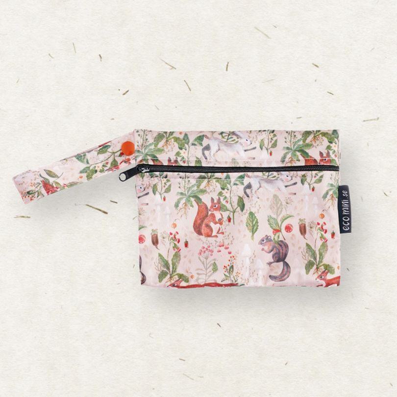 Floral and animal patterned Eco Mini wet bag on a light background