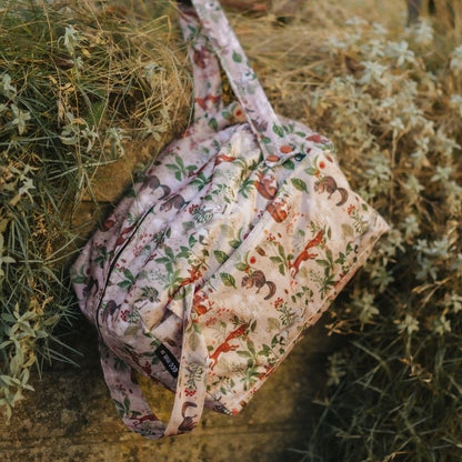 Eco Mini Cloth Diaper POD - squirrels print on a stone surface with plants in the background