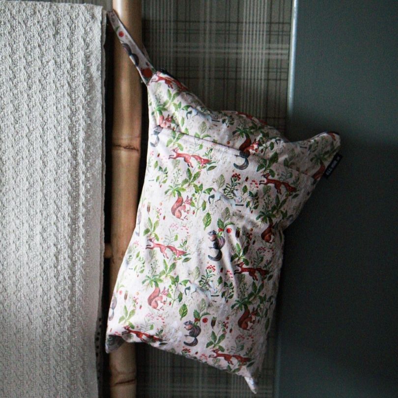 Eco Mini wet bag with squirrel print hanging on towel rail