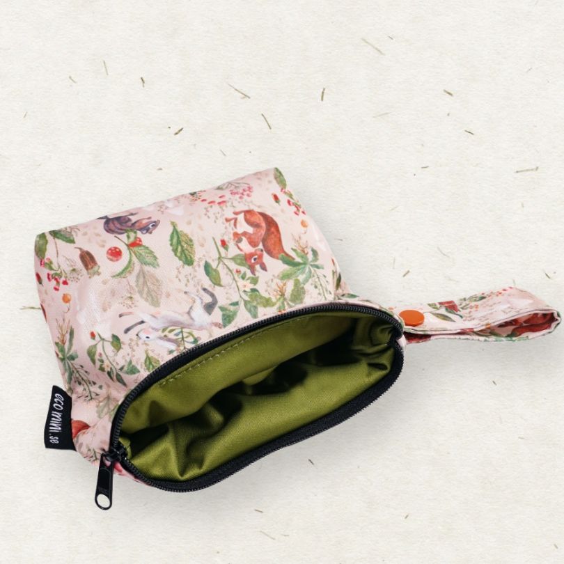 Floral-patterned Eco Mini wet bag with a green interior on a white background