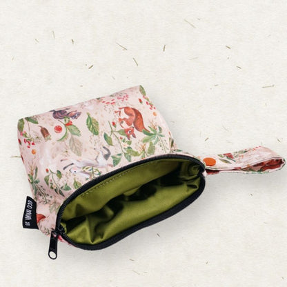 Floral-patterned Eco Mini wet bag with a green interior on a white background