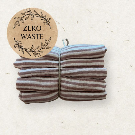 Stack of Eco Mini cloth wipes with a 'Zero Waste' sticker on a light background