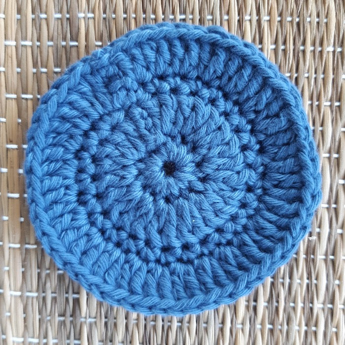 Blue crocheted face scrubby