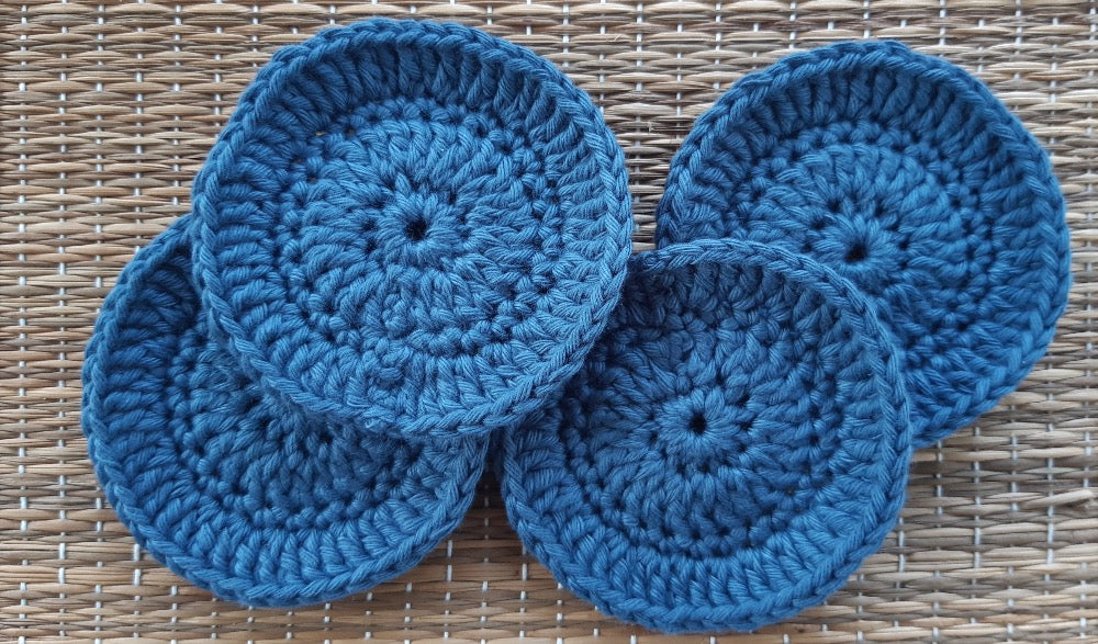 Set of 4 blue crocheted face scrubbies